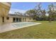 View of the house's backyard with a small pool and plenty of room for outdoor activities at 531 Gibson S Rd, Lakeland, FL 33813