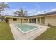 A backyard view showcasing the pool and architecture of the home at 531 Gibson S Rd, Lakeland, FL 33813