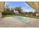 A view of the backyard showcasing the pool and trampoline at 531 Gibson S Rd, Lakeland, FL 33813