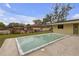 Backyard view of in-ground pool with a glimpse of the neighborhood at 531 Gibson S Rd, Lakeland, FL 33813