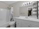 This bathroom features a shower-tub combo with a white vanity and sink at 531 Gibson S Rd, Lakeland, FL 33813