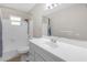 This bathroom features a shower-tub combo with a white vanity and sink at 531 Gibson S Rd, Lakeland, FL 33813