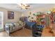 This bedroom features a ceiling fan, colorful decorations, and laminate floors at 531 Gibson S Rd, Lakeland, FL 33813