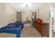 Simple bedroom featuring carpet floors, neutral walls, and ample natural light at 531 Gibson S Rd, Lakeland, FL 33813