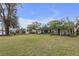 A long view of the property's exterior and well maintained lawn at 531 Gibson S Rd, Lakeland, FL 33813