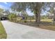 Charming single story home with a long driveway and mature trees in a landscaped yard at 531 Gibson S Rd, Lakeland, FL 33813