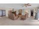 Inviting living room featuring neutral carpet, stone fireplace and comfortable seating at 531 Gibson S Rd, Lakeland, FL 33813