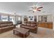 Expansive living room with plush seating, wet bar, and sliding glass doors to the outdoor space at 531 Gibson S Rd, Lakeland, FL 33813