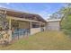 A view of the home's covered patio and storage shed at 531 Gibson S Rd, Lakeland, FL 33813