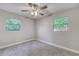 Bedroom with a ceiling fan and two windows at 5420 Ivory Ln, Lakeland, FL 33811