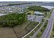 Aerial view of a community park with a dog park, playground, and swimming pool at 5431 Arlington River Dr, Lakeland, FL 33811