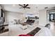 Open-concept living room flows to dining and kitchen featuring modern finishes and stainless steel appliances at 5431 Arlington River Dr, Lakeland, FL 33811