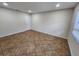 This bedroom features neutral tile flooring and ample natural light at 561 Lake Mystic Ln, Lakeland, FL 33813