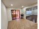 Bright dining area with sliding glass doors, connecting to a sunroom or patio at 561 Lake Mystic Ln, Lakeland, FL 33813