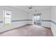 Bedroom with sliding glass door leading to screened in porch at 5725 Mallard Dr, Lakeland, FL 33809