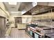 Large commercial kitchen with stainless steel appliances and ample counter space at 5725 Mallard Dr, Lakeland, FL 33809