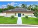 Community center exterior with manicured landscaping and blue accents at 5725 Mallard Dr, Lakeland, FL 33809