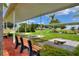 View of outdoor recreational area with cornhole game, benches and shade at 5725 Mallard Dr, Lakeland, FL 33809