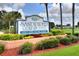 Sandpiper Golf & Country Club community sign with manicured landscaping and blue skies at 5725 Mallard Dr, Lakeland, FL 33809