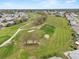 Aerial view of golf course with tree-lined fairways at 5725 Mallard Dr, Lakeland, FL 33809