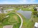 Picturesque golf course with lush green fairways, scenic ponds, and a view of the surrounding community at 5725 Mallard Dr, Lakeland, FL 33809