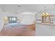 Bright living room with sliding glass doors leading to a screened-in patio at 5725 Mallard Dr, Lakeland, FL 33809