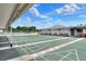 Exterior view of shuffleboard courts with shade cover and adjacent seating benches at 5725 Mallard Dr, Lakeland, FL 33809