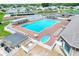 Aerial view of a community swimming pool, hot tub, and lounge area with ample seating at 5725 Mallard Dr, Lakeland, FL 33809