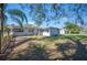 Backyard featuring grassy lawn and a storage shed at 624 Woodward St, Lakeland, FL 33803