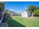 View of backyard with a shed and play set at 624 Woodward St, Lakeland, FL 33803