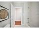 Bright bathroom features white subway tile, hexagon tile floor, and combination shower and tub at 624 Woodward St, Lakeland, FL 33803