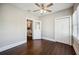 Bedroom featuring hardwood floors, ceiling fan, and an ensuite sitting area at 624 Woodward St, Lakeland, FL 33803