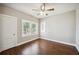 Bedroom featuring hardwood floors, ceiling fan, and natural light from windows at 624 Woodward St, Lakeland, FL 33803