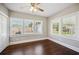 Bedroom featuring hardwood floors and natural light from multiple windows at 624 Woodward St, Lakeland, FL 33803