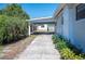 View of the house showing the driveway leading up to the carport and the adjacent new shed at 624 Woodward St, Lakeland, FL 33803