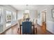 Bright dining room with hardwood floors, wainscotting, and a modern chandelier at 624 Woodward St, Lakeland, FL 33803