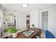 Home office with a view to the sunroom, textured walls, closet, and a neutral color palette at 624 Woodward St, Lakeland, FL 33803