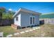 Backyard shed with double doors and pavers at 624 Woodward St, Lakeland, FL 33803