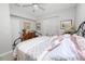 Relaxing bedroom featuring a decorative bed frame, ceiling fan and ample natural light at 6329 Torrington Cir, Lakeland, FL 33811