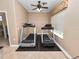 A home exercise room with two treadmills, offering a convenient space for fitness and wellness activities at 6329 Torrington Cir, Lakeland, FL 33811