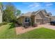 Beautiful home featuring a well-manicured lawn, brick walkway, and a two-car garage at 6329 Torrington Cir, Lakeland, FL 33811