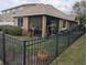 Fenced backyard with screened lanai and manicured landscaping at 6397 Torrington Cir, Lakeland, FL 33811