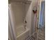 Clean bathroom with a tiled shower, a white shower curtain and decorative elements at 6397 Torrington Cir, Lakeland, FL 33811