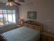 Bedroom features a large window that floods the room with natural light at 6397 Torrington Cir, Lakeland, FL 33811