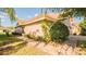 Beautiful exterior view of a home with a brick walkway and lush landscaping at 6397 Torrington Cir, Lakeland, FL 33811