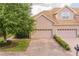 This spacious home has a 2-car garage and brick driveway and walkway at 6397 Torrington Cir, Lakeland, FL 33811