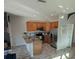 Spacious kitchen featuring stainless steel appliances and granite countertops at 6397 Torrington Cir, Lakeland, FL 33811