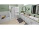 Bathroom featuring double sinks, a soaking tub, and a separate shower at 7211 Scenic Hills Blvd, Lakeland, FL 33810