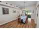 Charming dining room with wood-look flooring and a table set for eight, perfect for Gathering gatherings at 7211 Scenic Hills Blvd, Lakeland, FL 33810