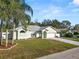 Inviting single-story home with a two-car garage and freshly landscaped front yard at 7211 Scenic Hills Blvd, Lakeland, FL 33810